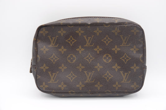 Brown Louis Vuitton bag with monogram pattern on a white background