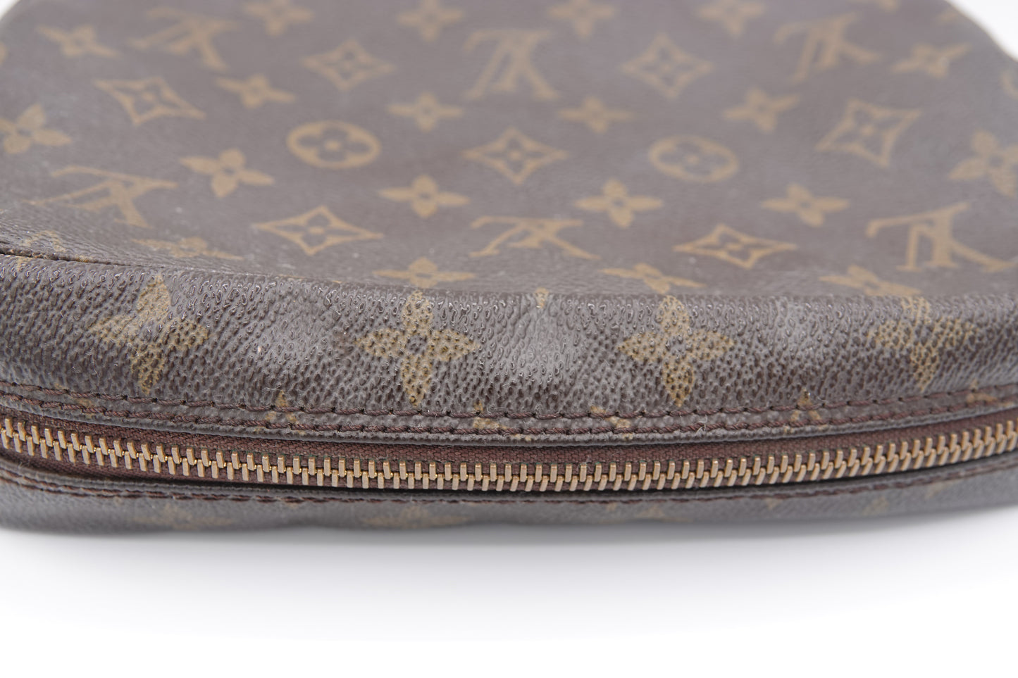 Brown Louis Vuitton bag with monogram pattern on a white background