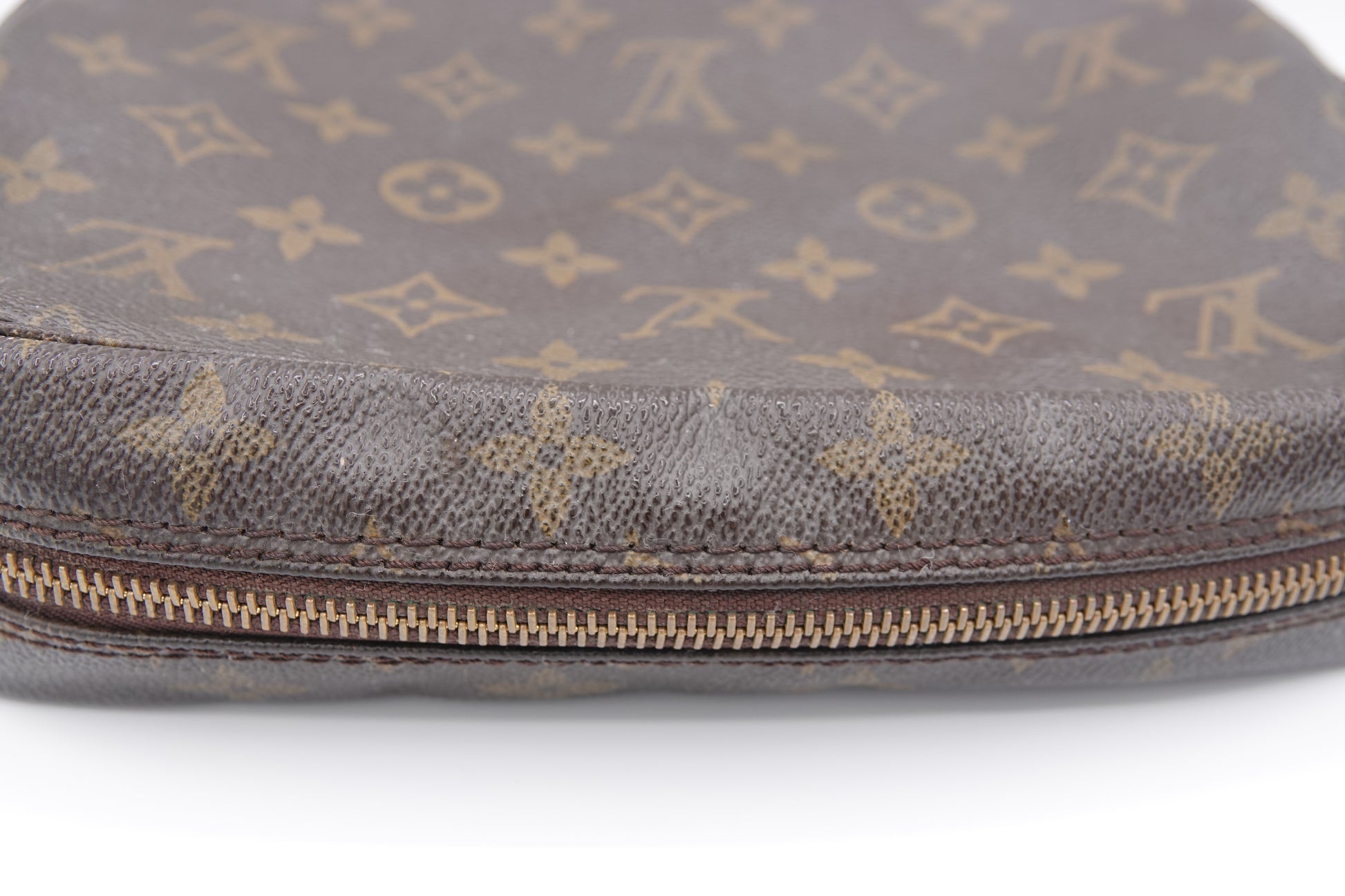 Brown Louis Vuitton bag with monogram pattern on a white background