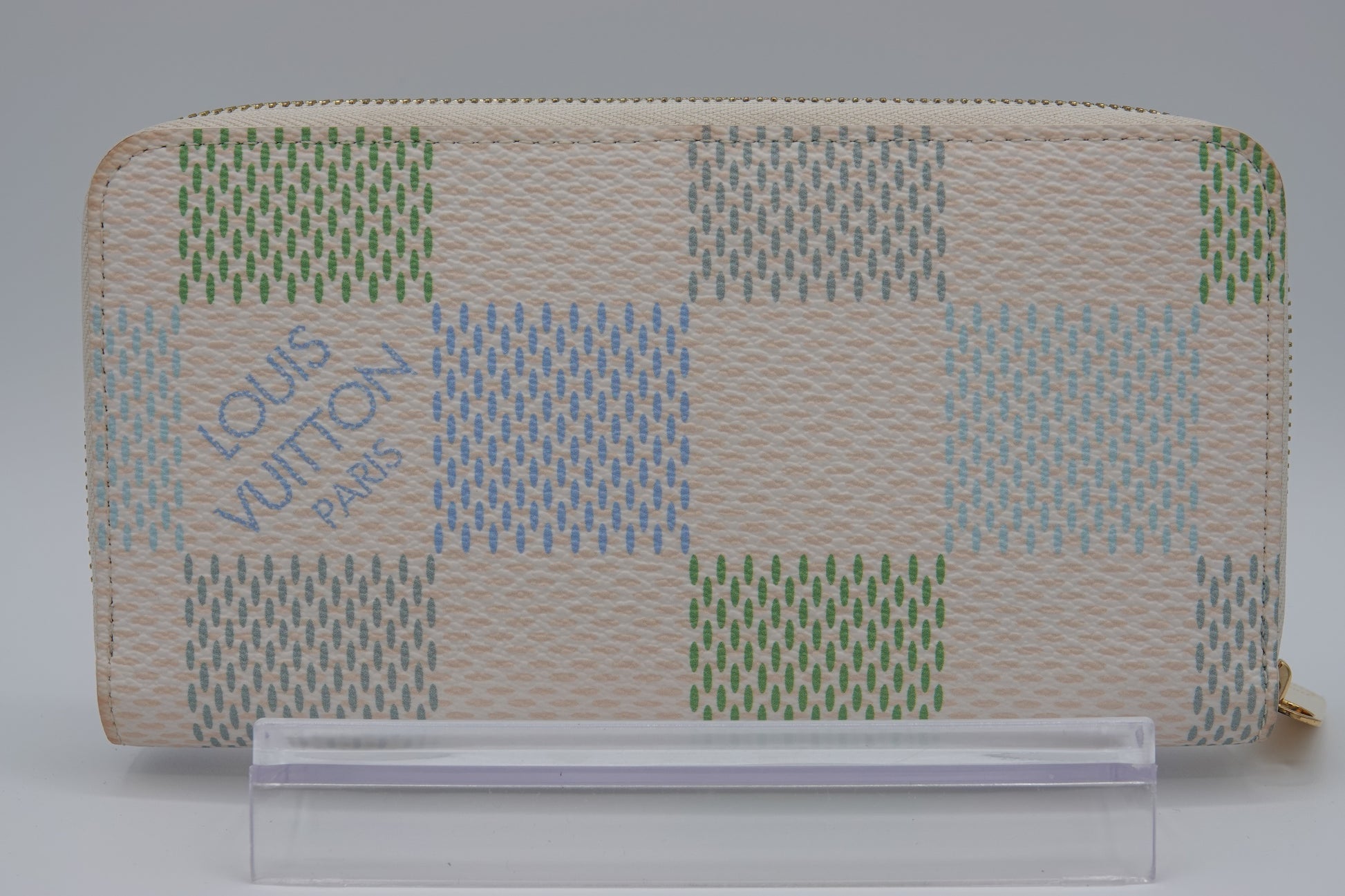 Louis Vuitton wallet with a checkered pattern on a stand