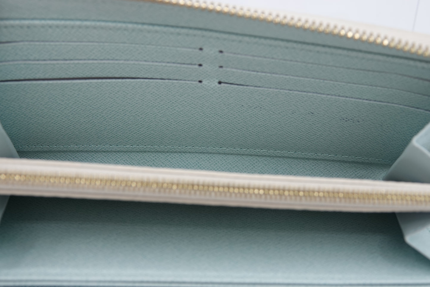 Close-up of a light blue pouch with a zipper