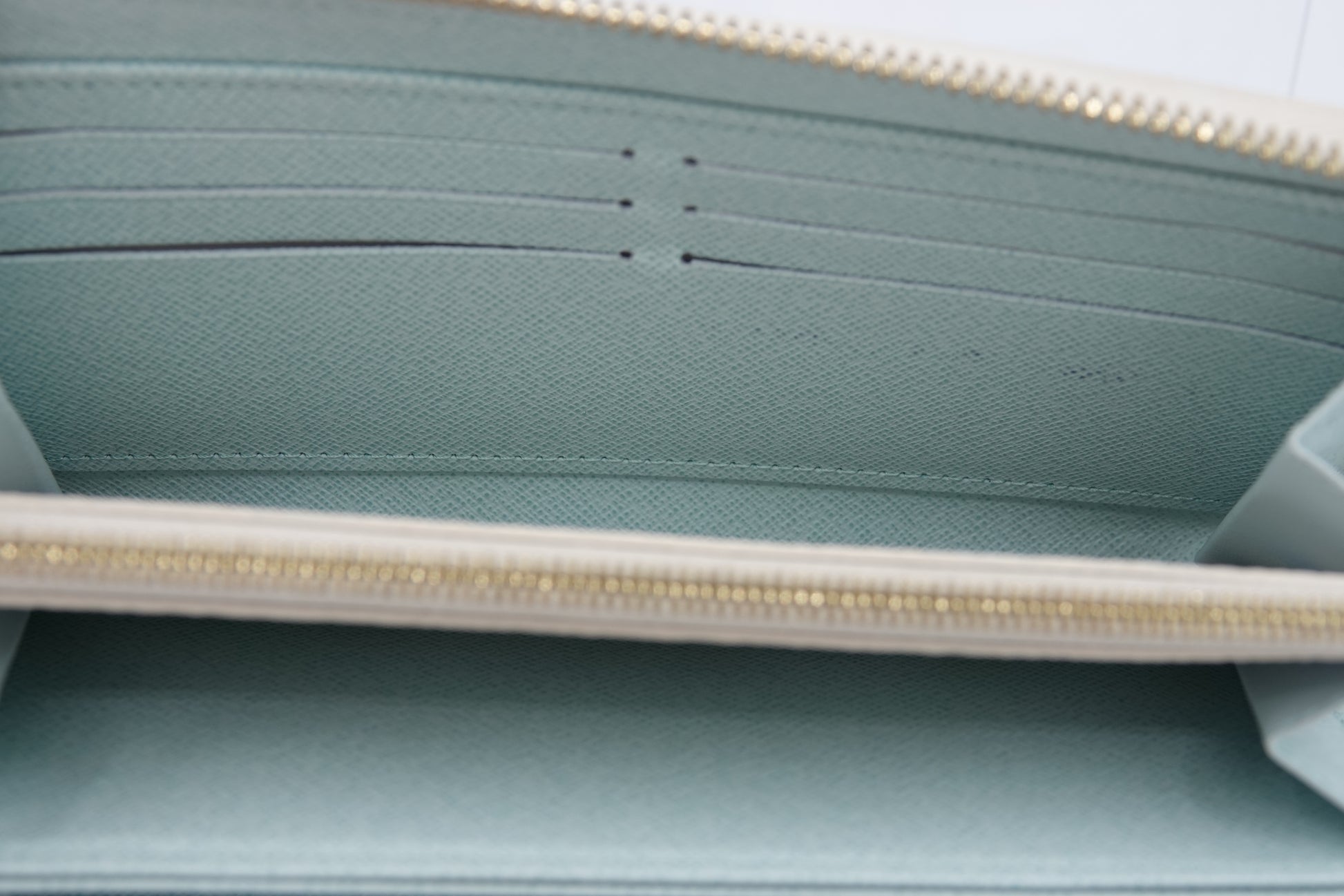 Close-up of a light blue pouch with a zipper