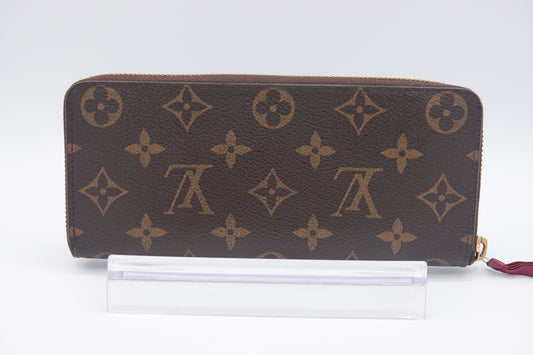 Designer wallet with monogram pattern on a white background