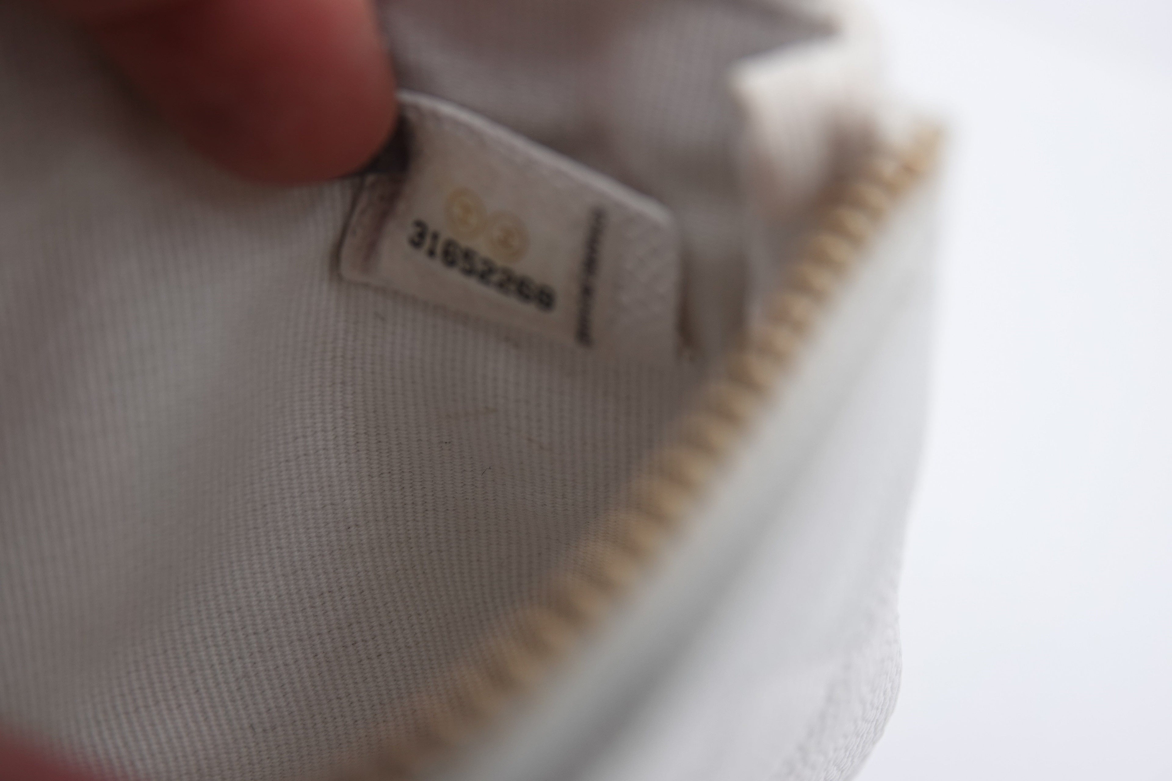 Close-up of a label on a white garment with a blurred background