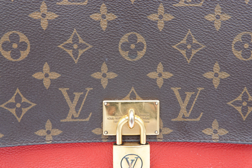 Louis Vuitton patterned fabric with a gold padlock.