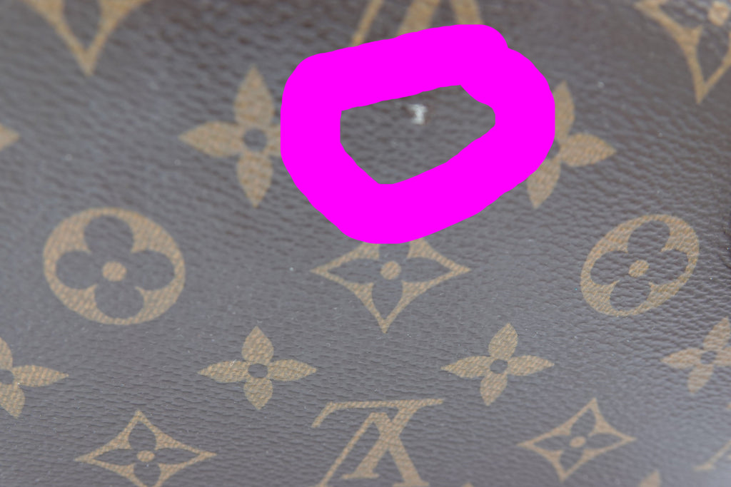 Close-up of a textured surface with a prominent pink circle overlay