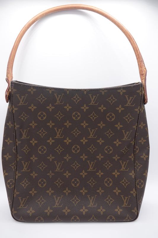 Brown handbag with a prominent pattern on a white background