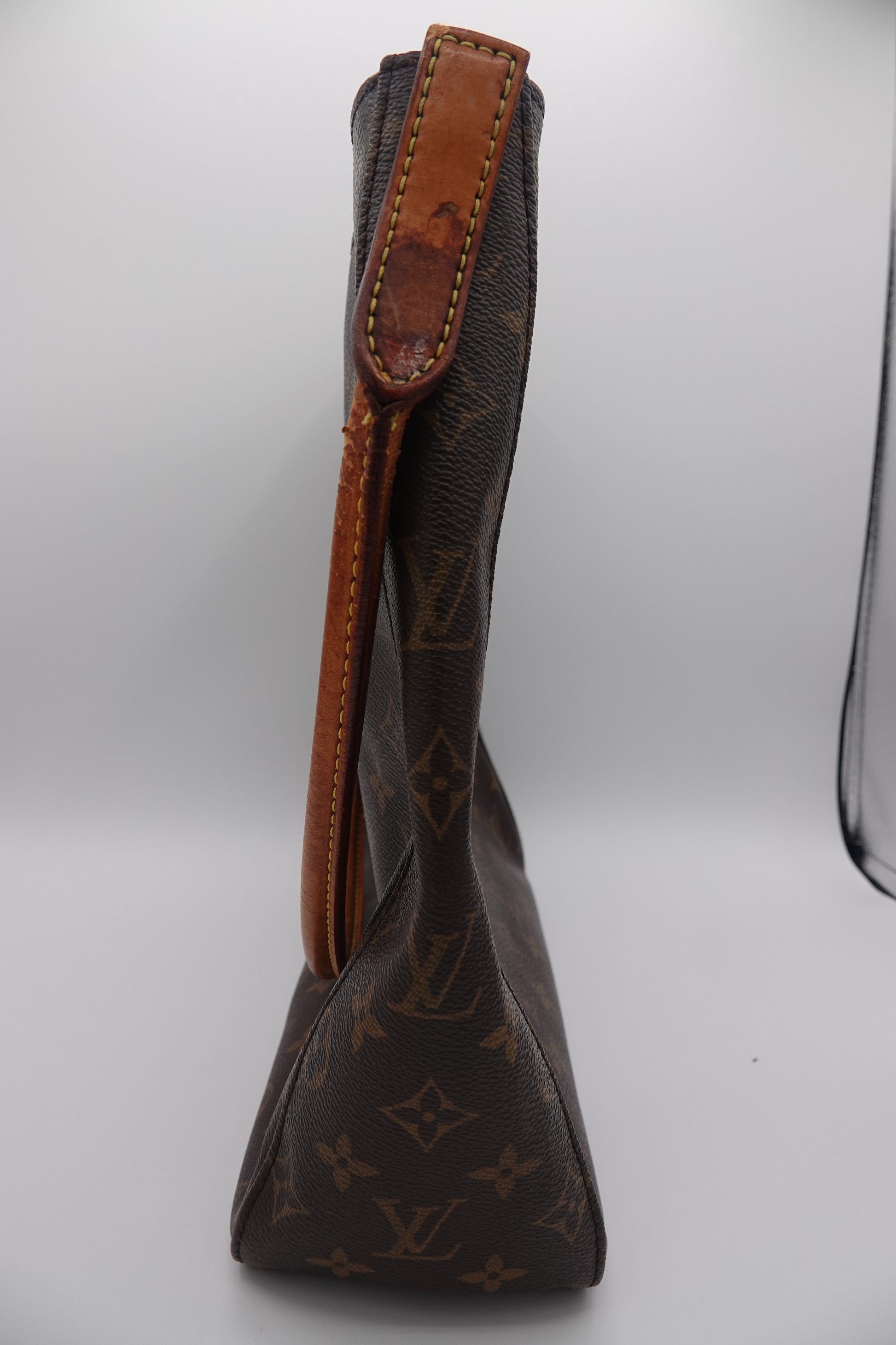 Brown leather bow tie with pattern on a white background