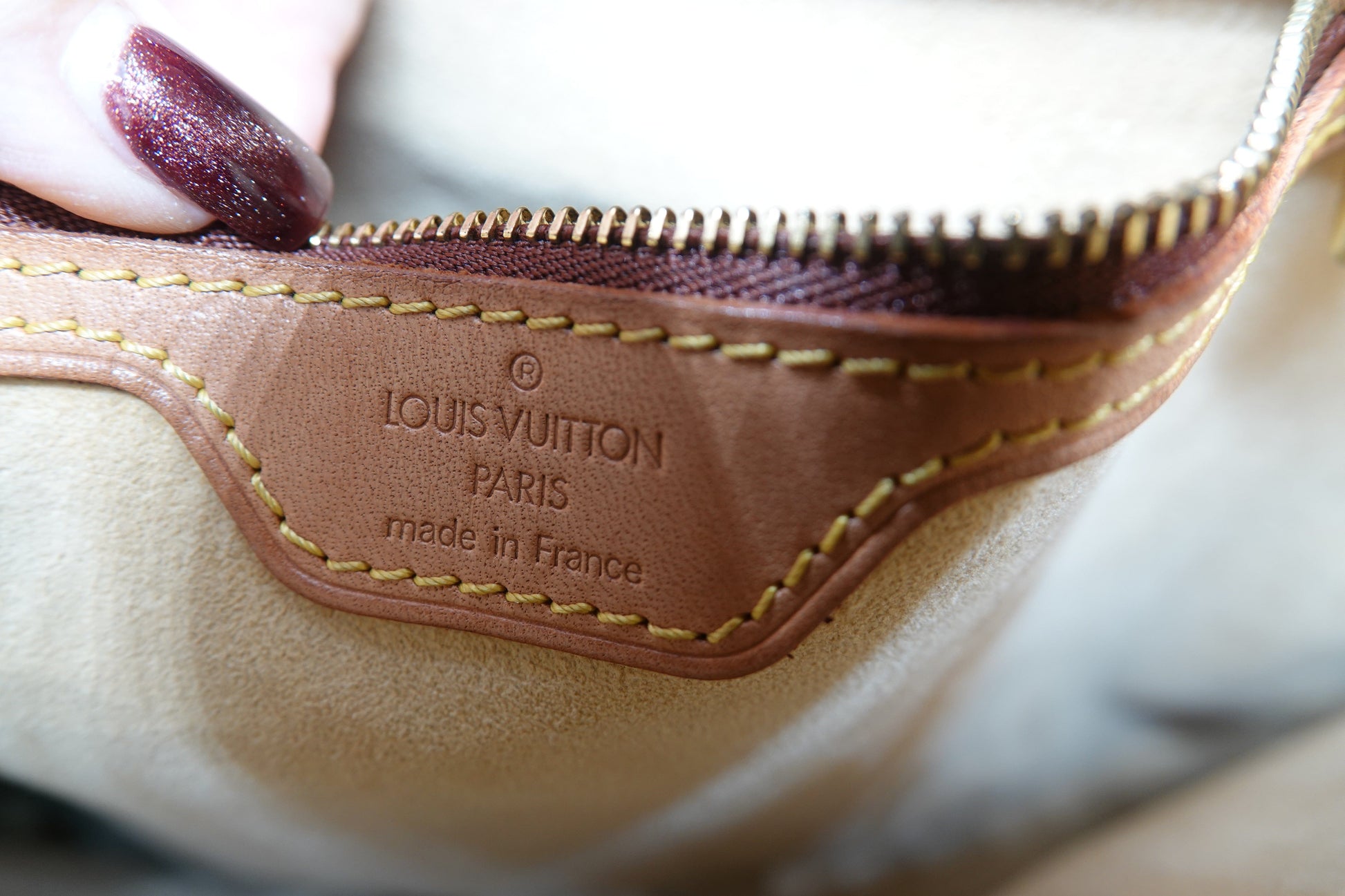 Close-up of a Louis Vuitton bag with visible branding.