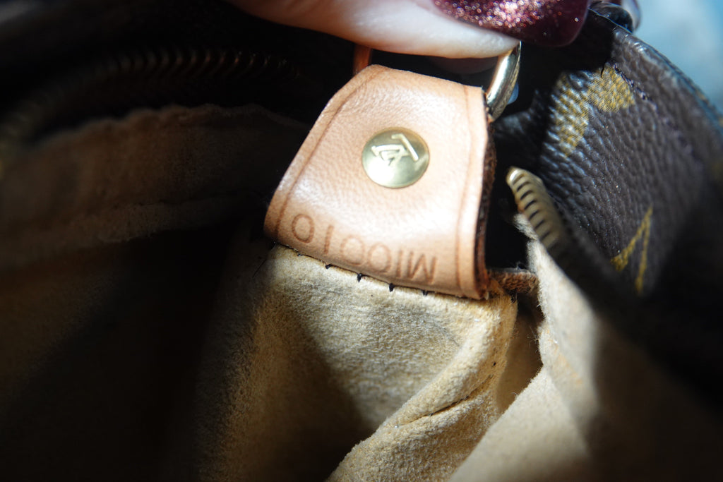 Close-up of a Louis Vuitton bag with a visible logo.