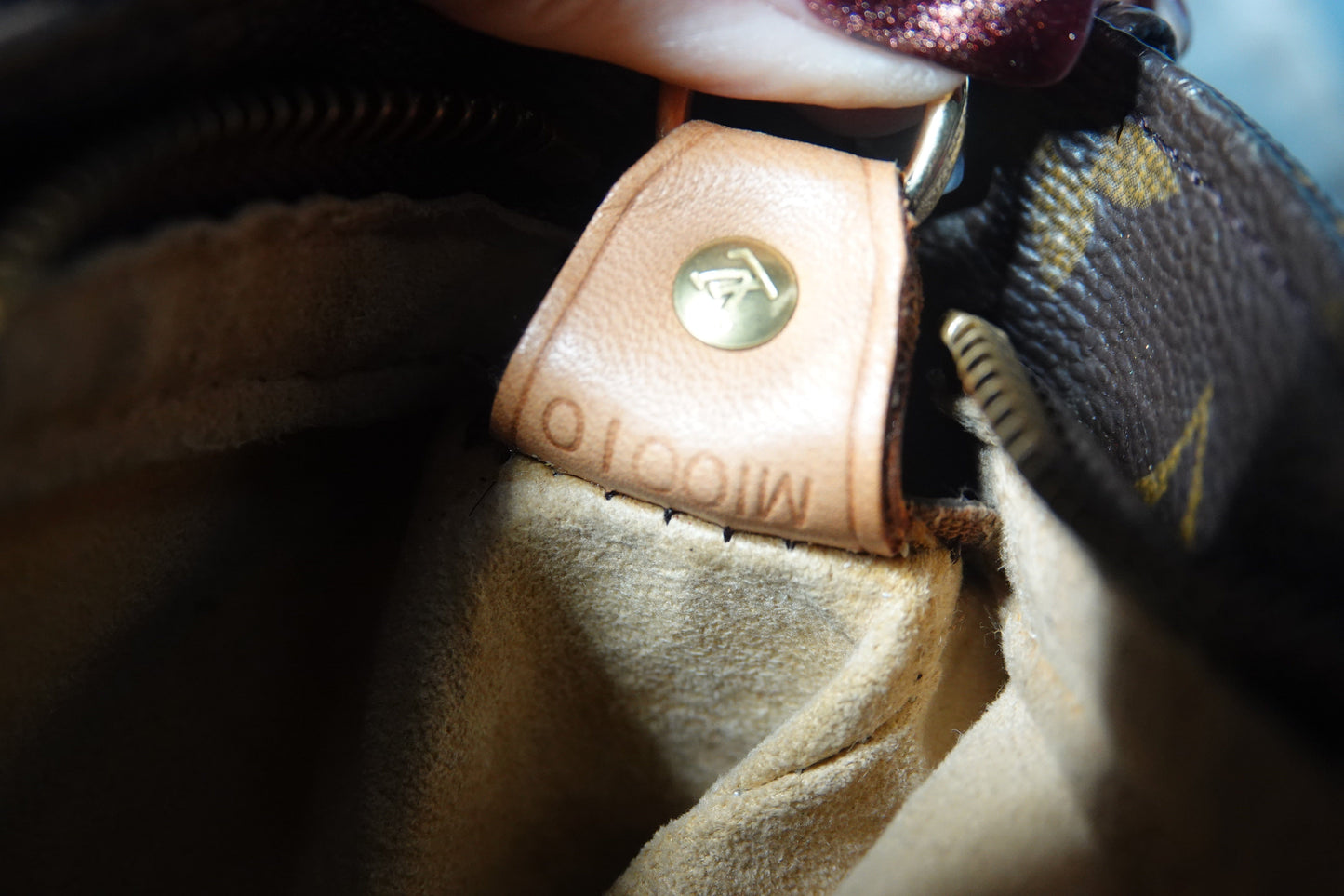 Close-up of a Louis Vuitton bag with a visible logo.