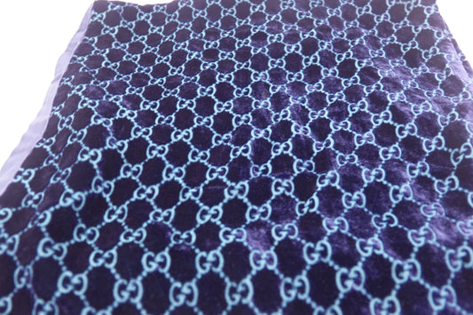 Fabric with a blue and purple pattern on a white background