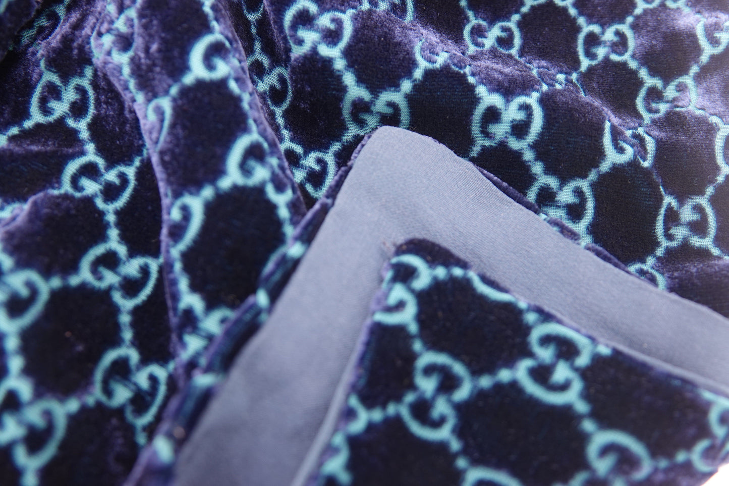 Close-up of purple fabric with a geometric pattern