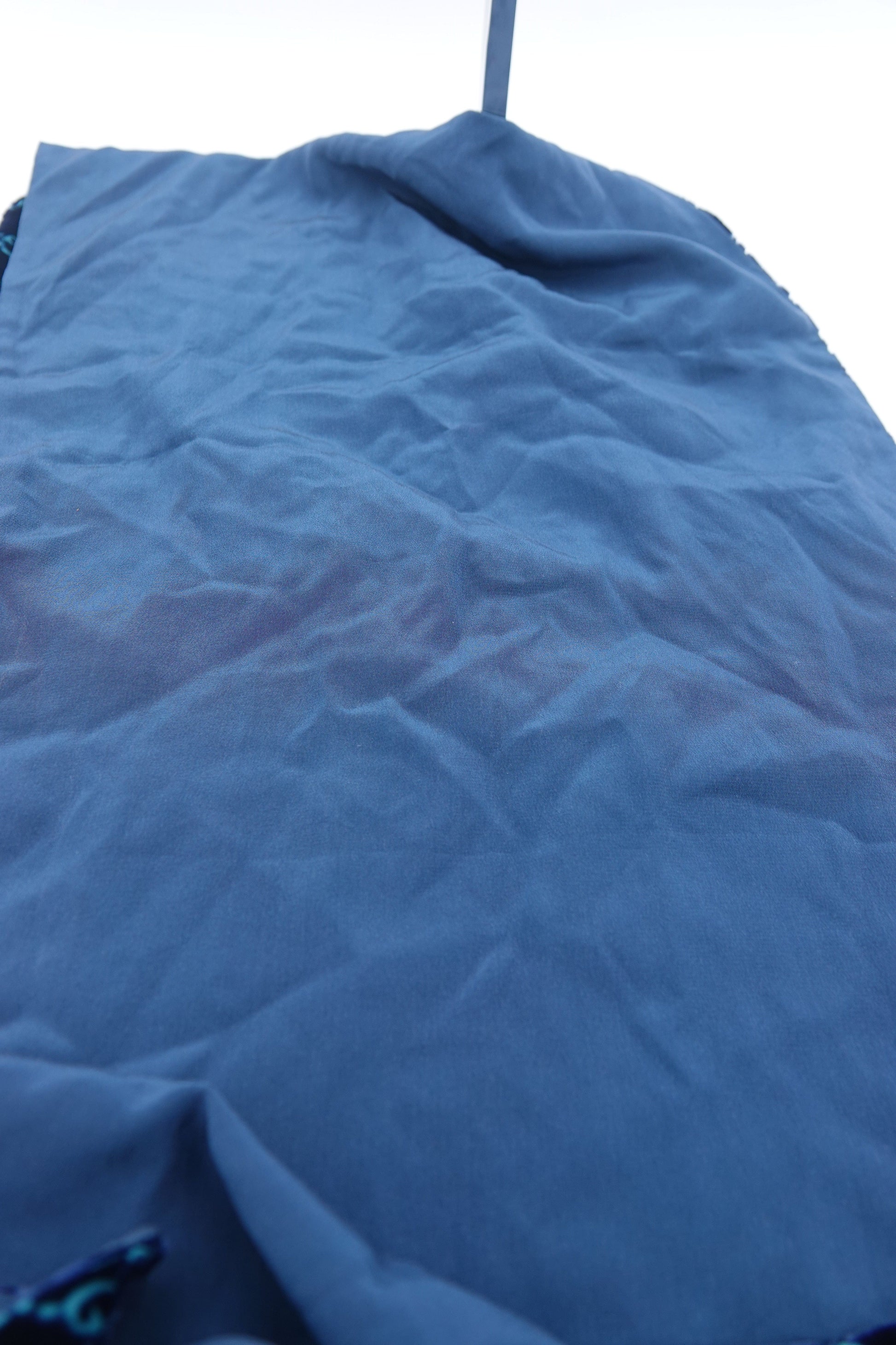 Close-up of a textured blue fabric surface