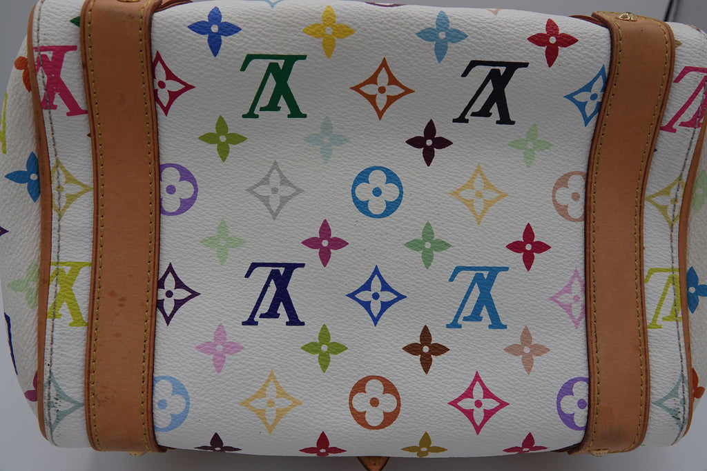 White bag with colorful monogram pattern and brown leather straps