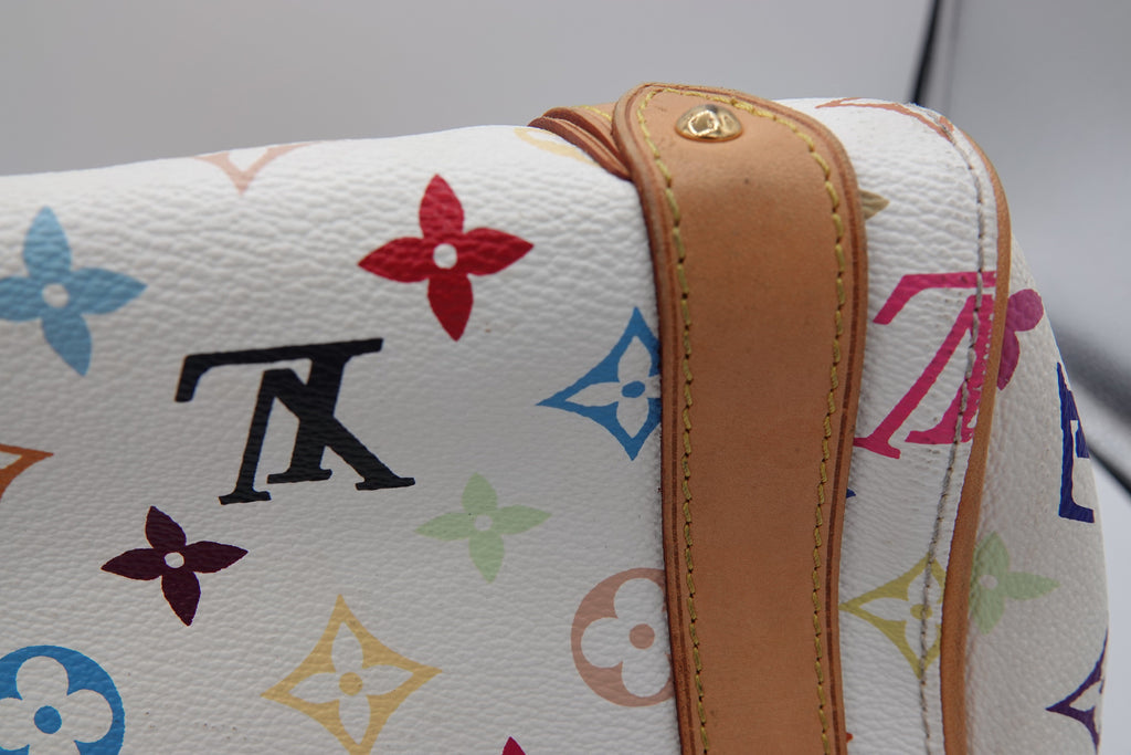 Close-up of a Louis Vuitton handbag with multicolor monogram pattern and brown leather strap.
