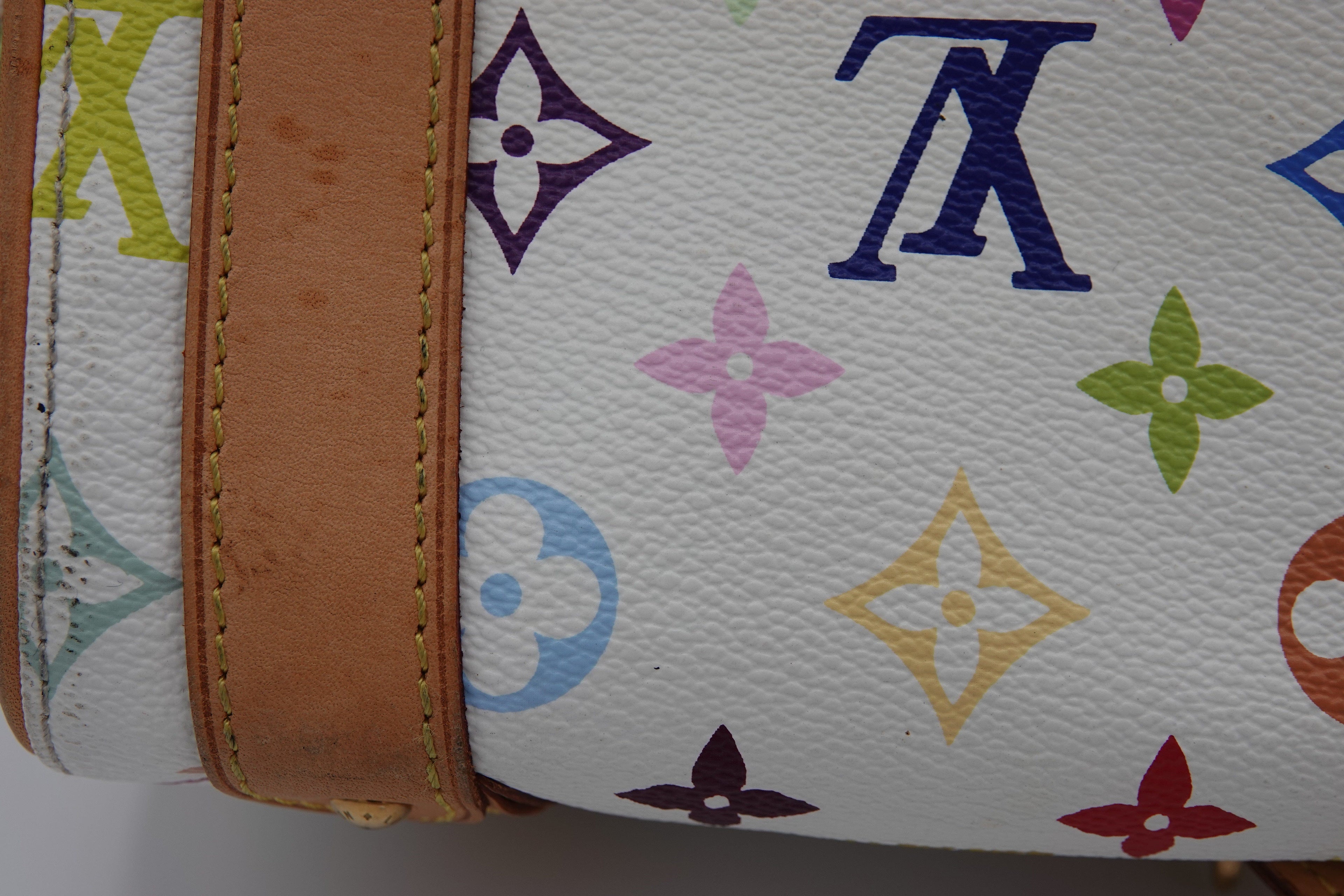 Close-up of a multicolored patterned fabric with a brown border.