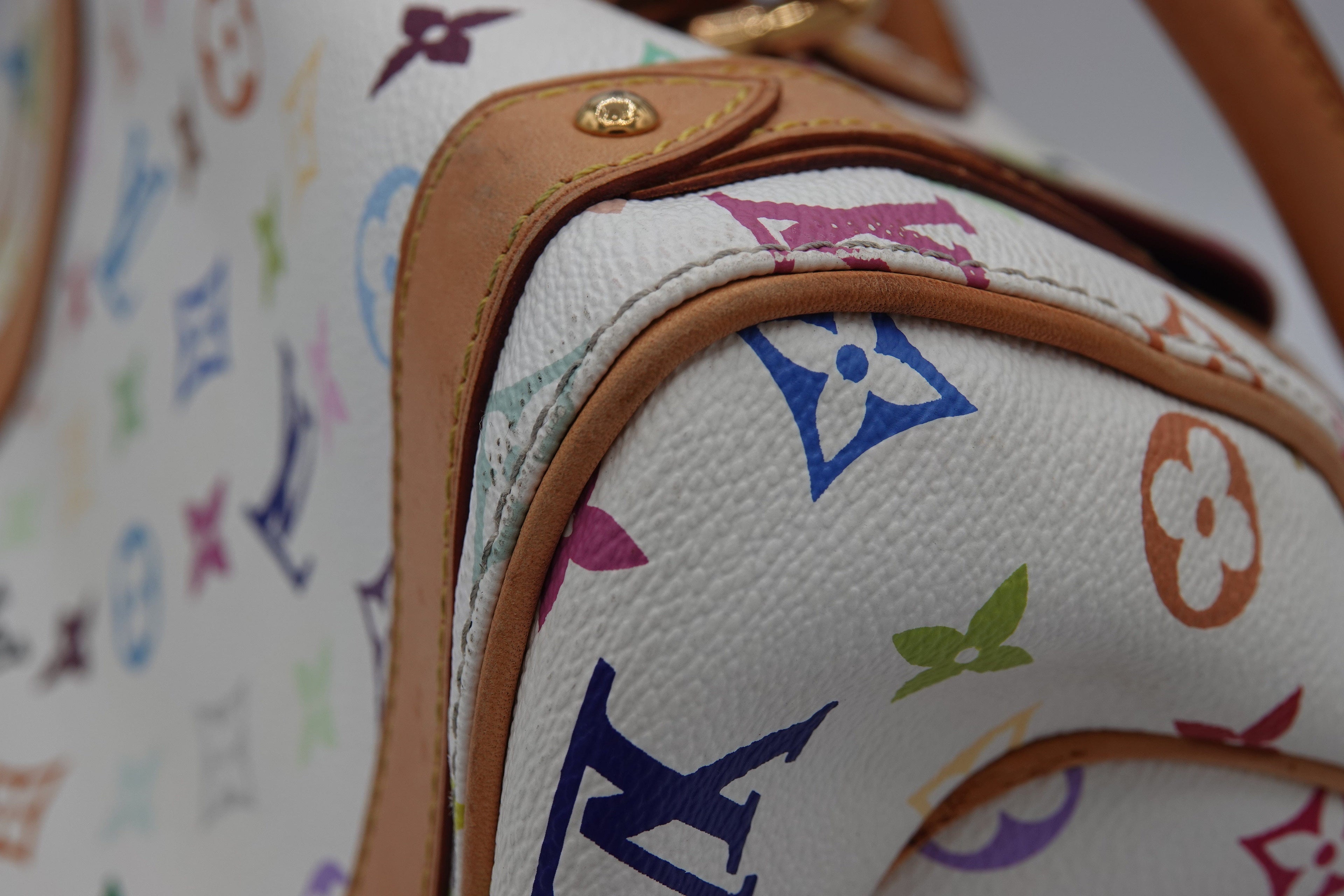 Close-up of a Louis Vuitton handbag with multicolor monogram pattern