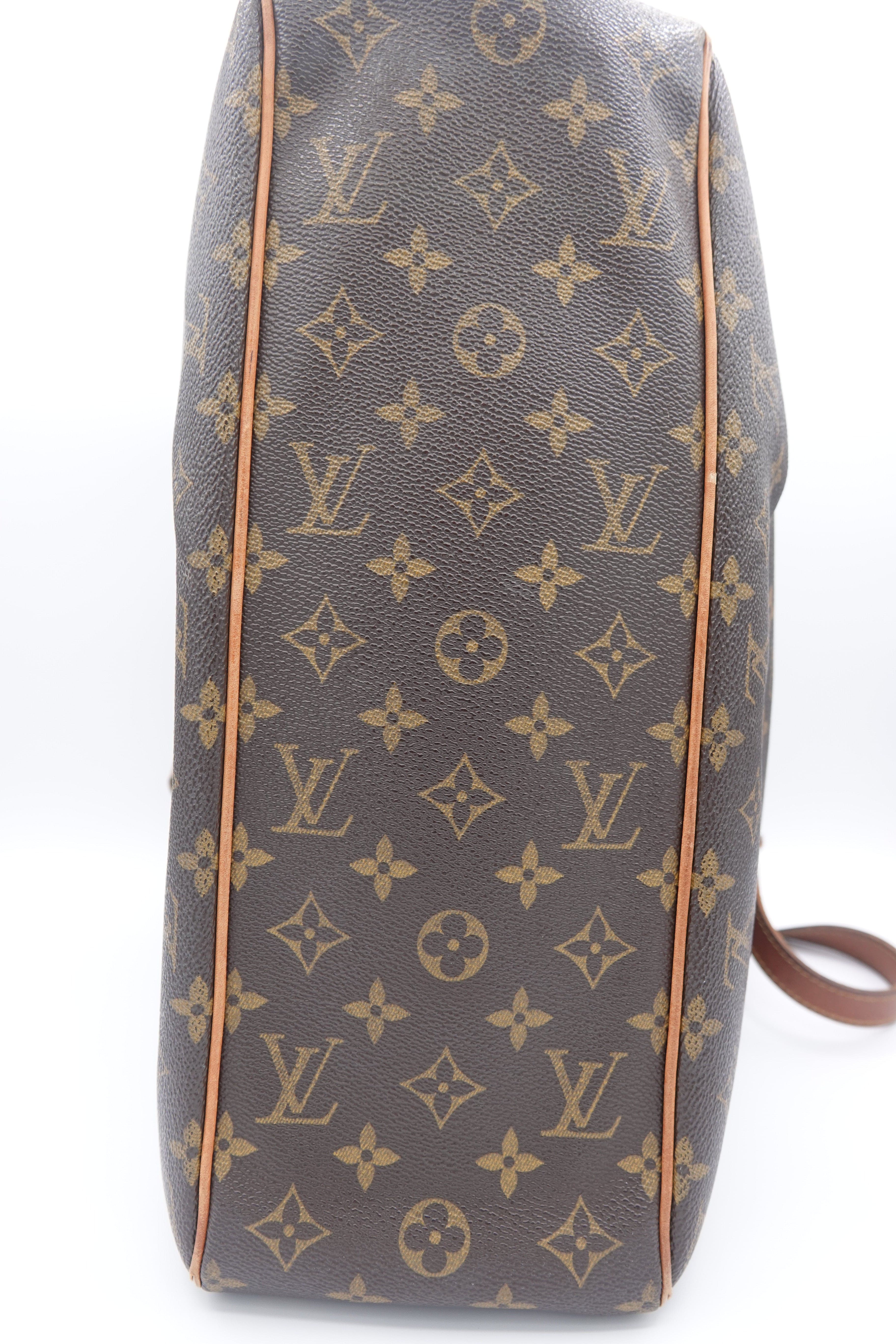 Louis Vuitton monogram handbag on a white background