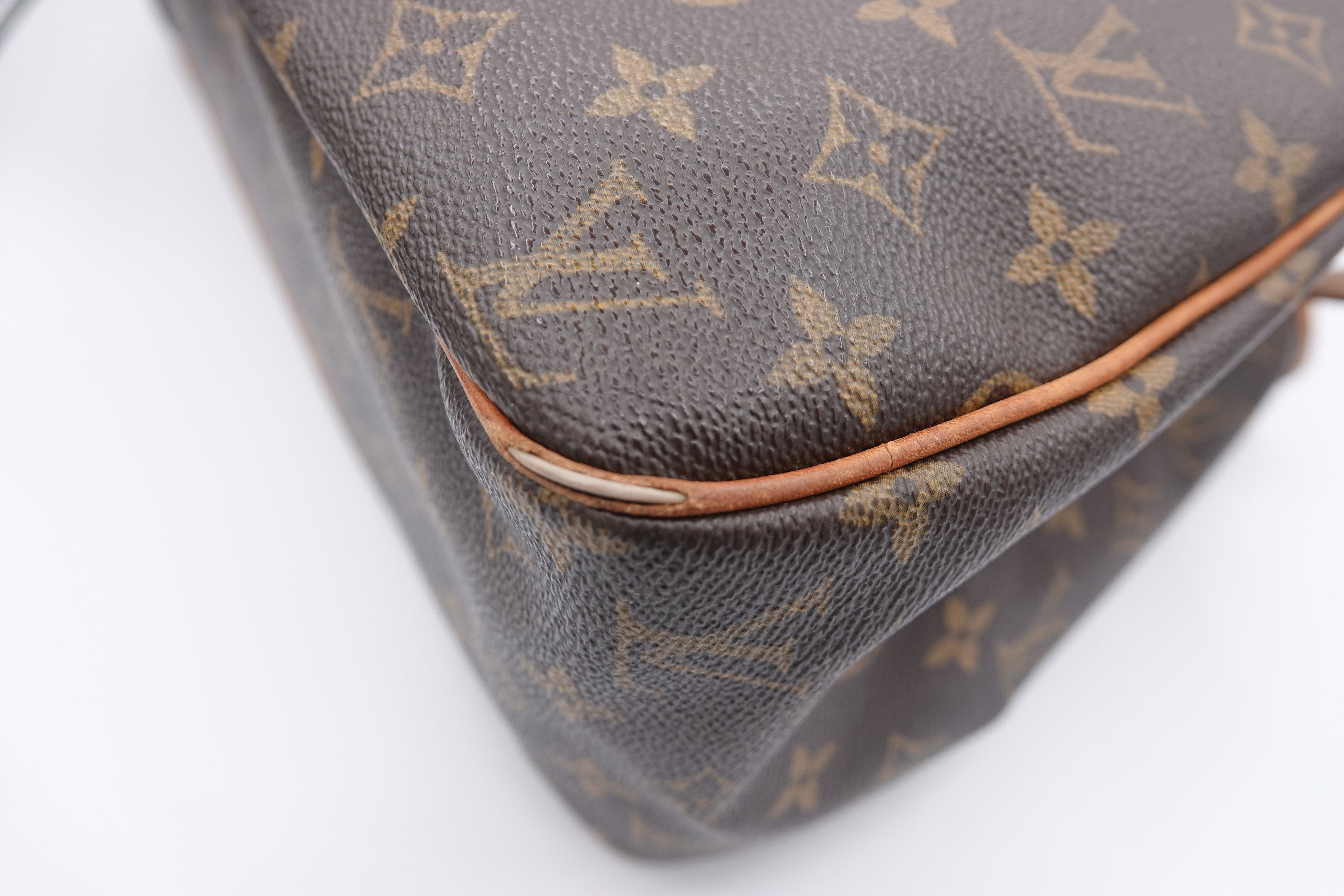 Louis Vuitton monogram handbag on a white background