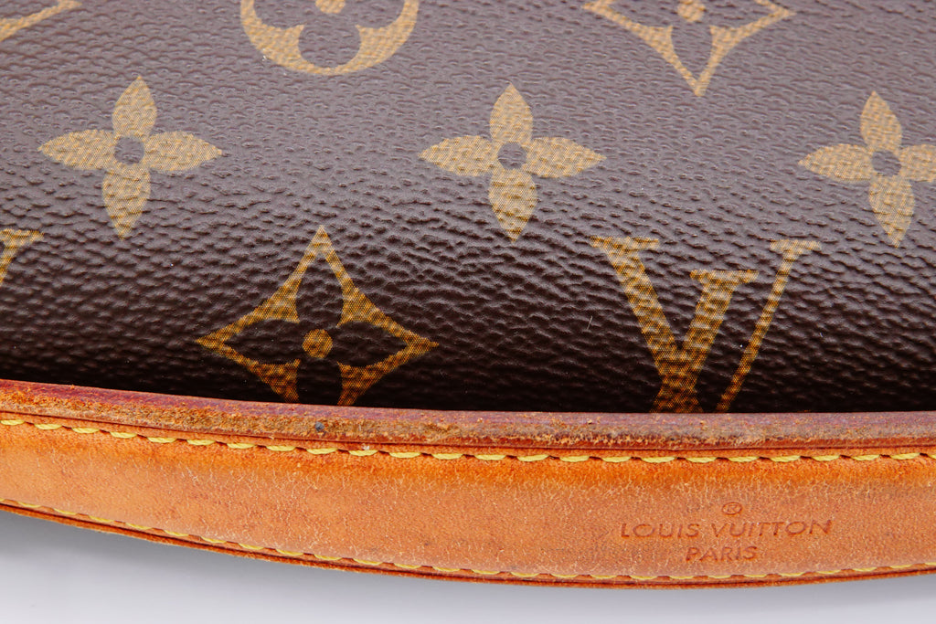 Close-up of a Louis Vuitton handbag with monogram pattern and visible brand logo.