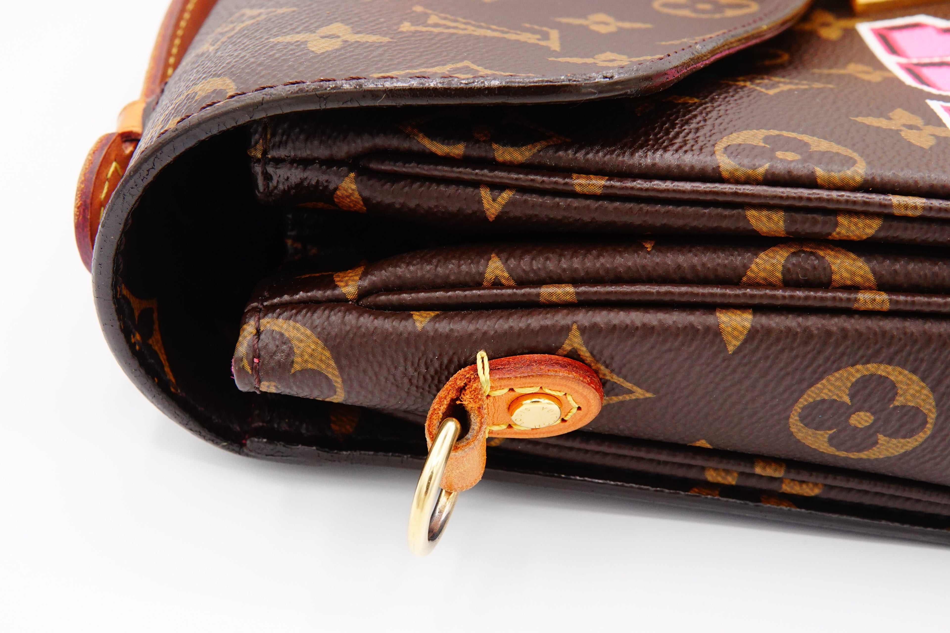 Close-up of a brown leather wallet with gold accents on a white background