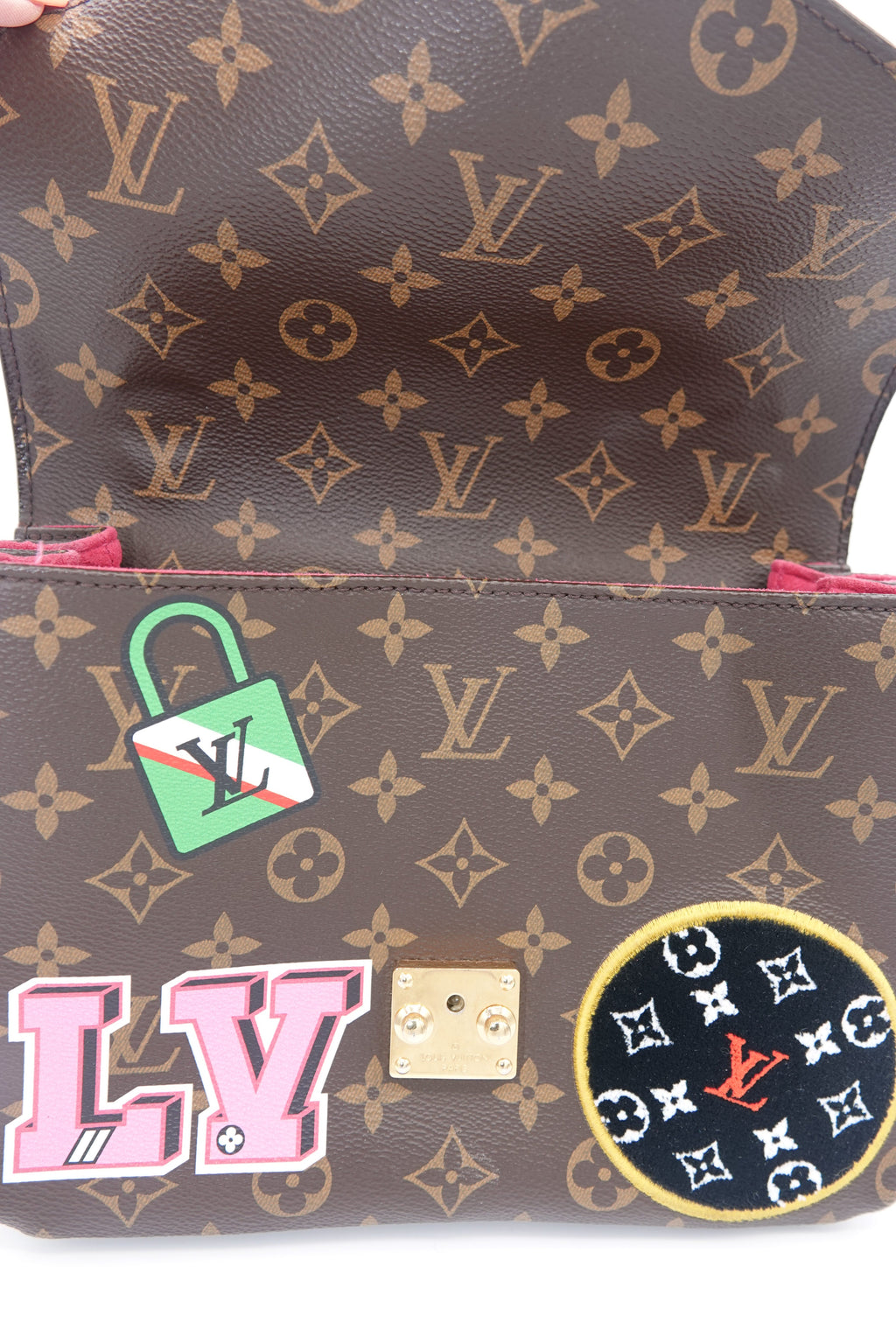 Louis Vuitton monogram handbag with decorative patches