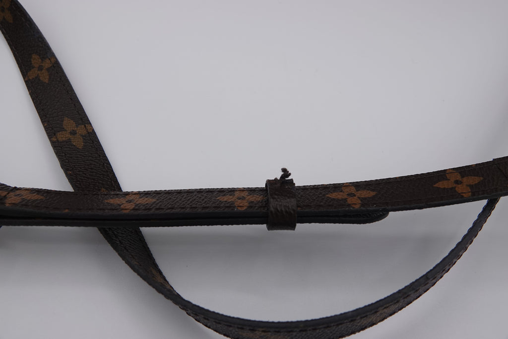 Brown leather belt with a pattern on a white background