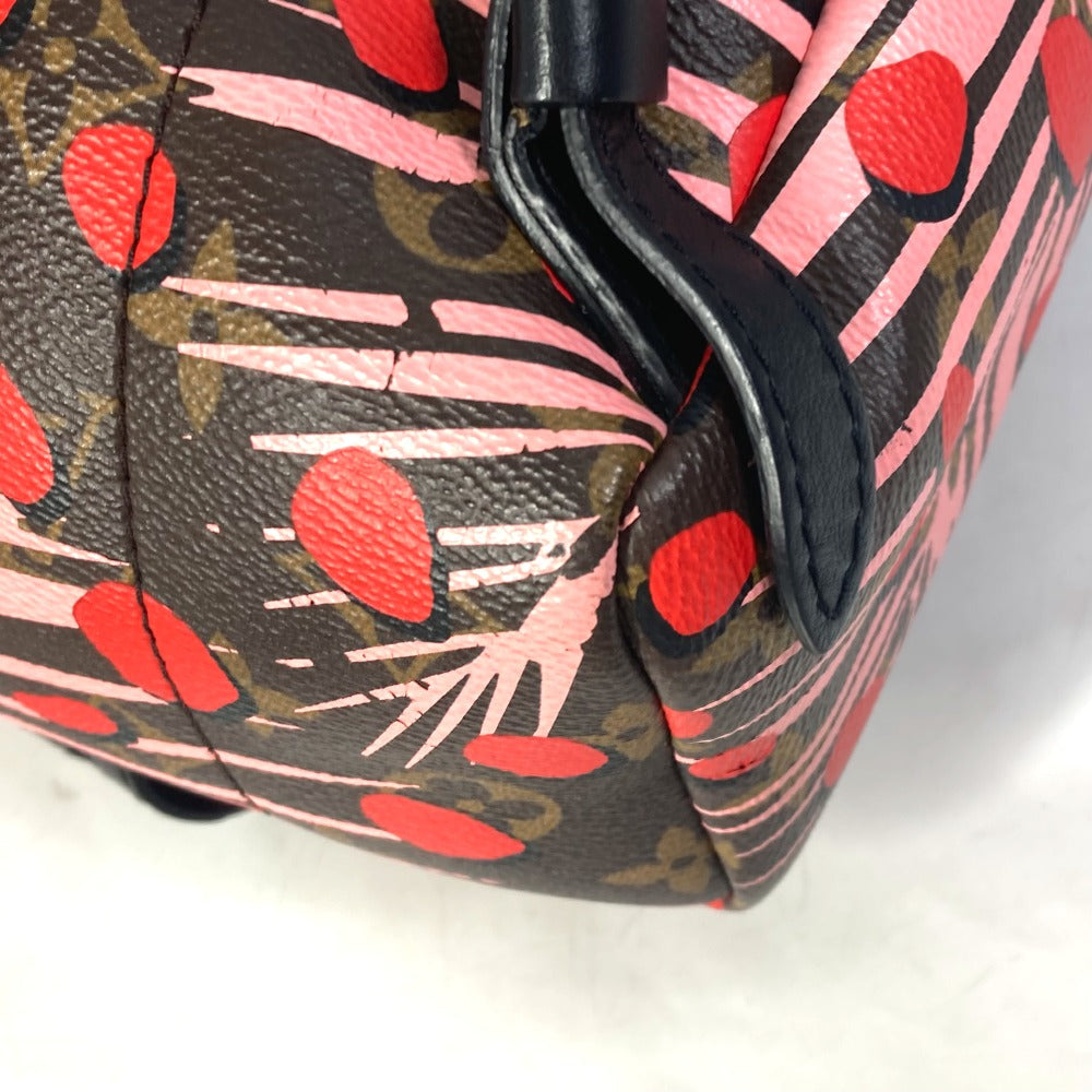 Close-up of a handbag with a floral pattern on a white background