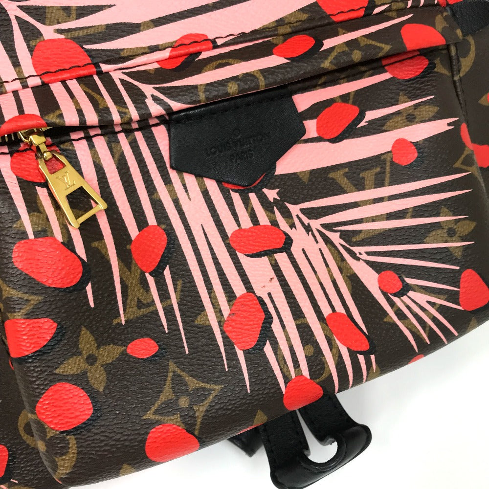 Designer handbag with red heart pattern and visible brand logo on a white background