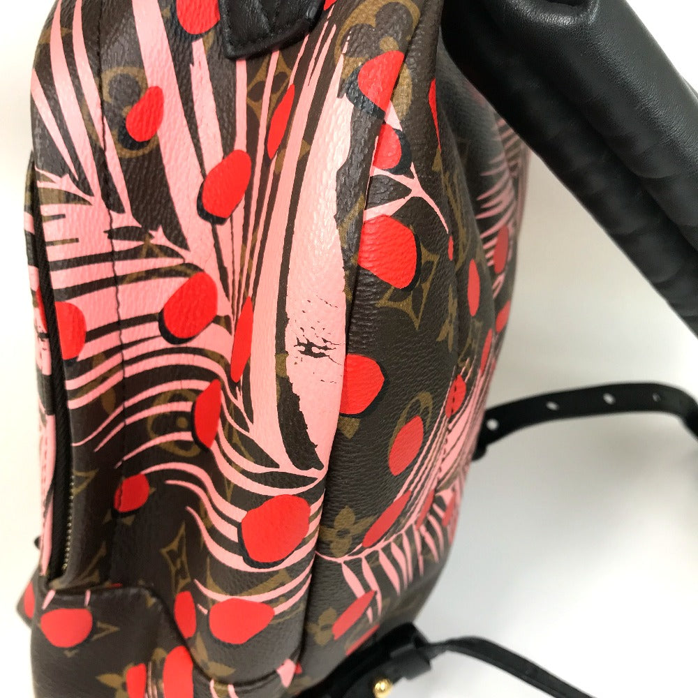 Backpack with a colorful pattern featuring red shapes on a white background