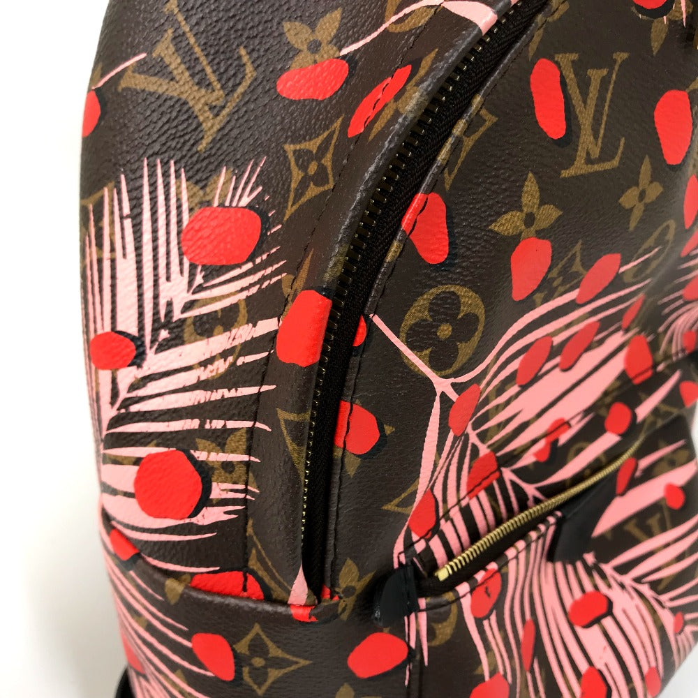 Designer handbag with tropical pattern and visible brand logo