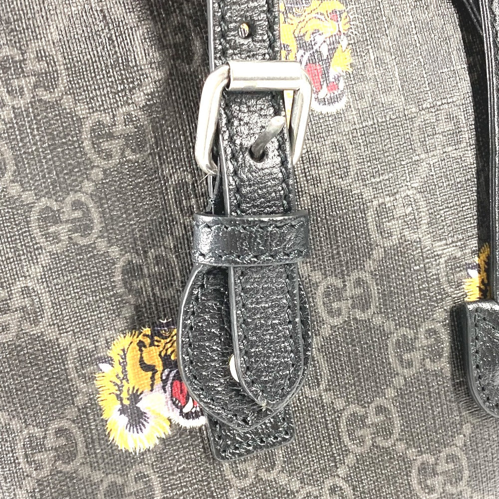 Close-up of a Gucci belt with monogram pattern