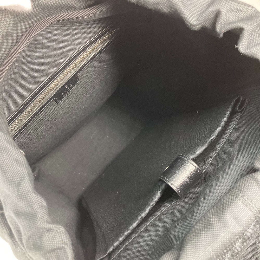 Close-up of a gray backpack interior with a zipper and strap.