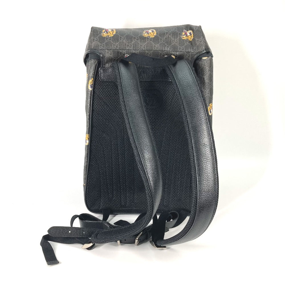 Black backpack with patterned top on a white background