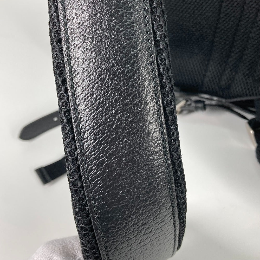 Close-up of a black leather armrest on a chair with a white background