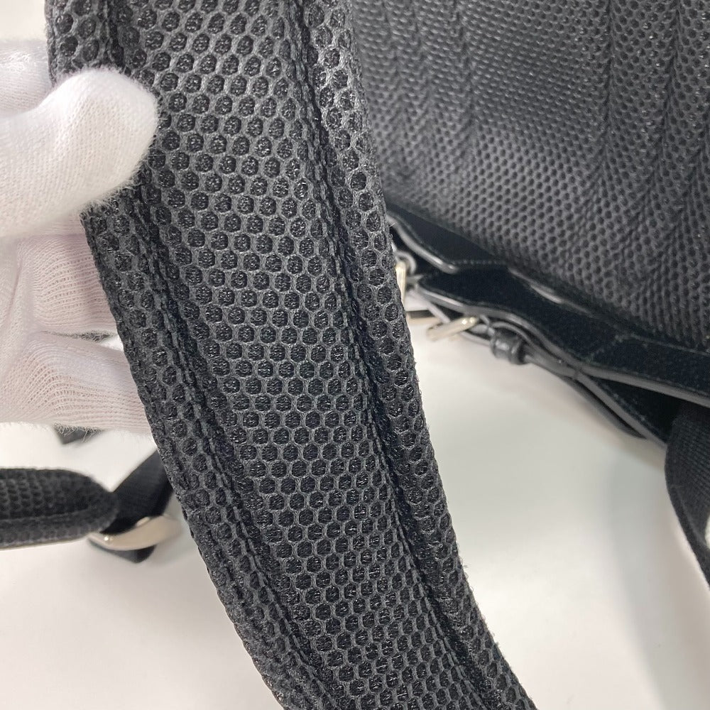 Close-up of a textured black strap on a product with a white background