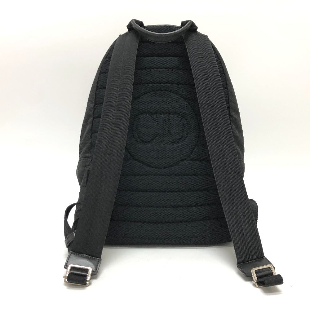 Black backpack with a brand logo on the back on a white background