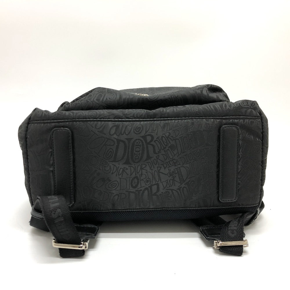 Black backpack with visible branding on a white background