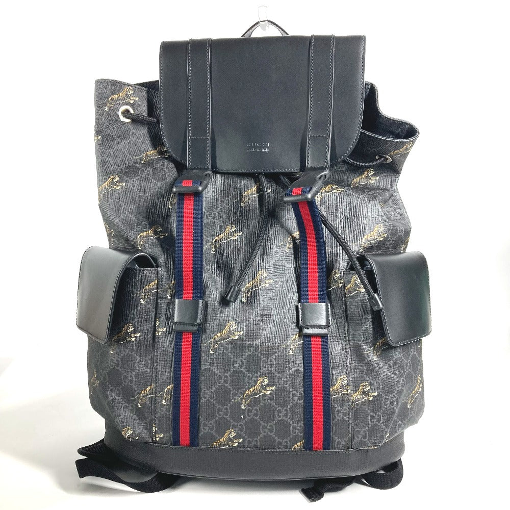 Gray backpack with red and blue stripes on a white background