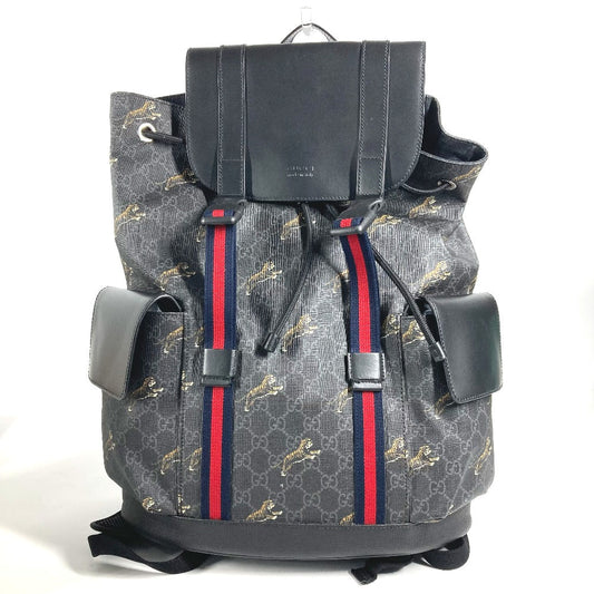 Gray backpack with red and blue stripes on a white background