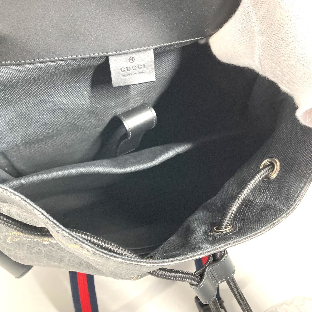 Gray backpack with Gucci logo on a light background