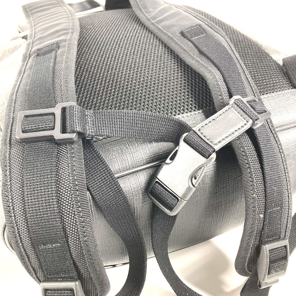 Close-up of a gray backpack with straps on a white background