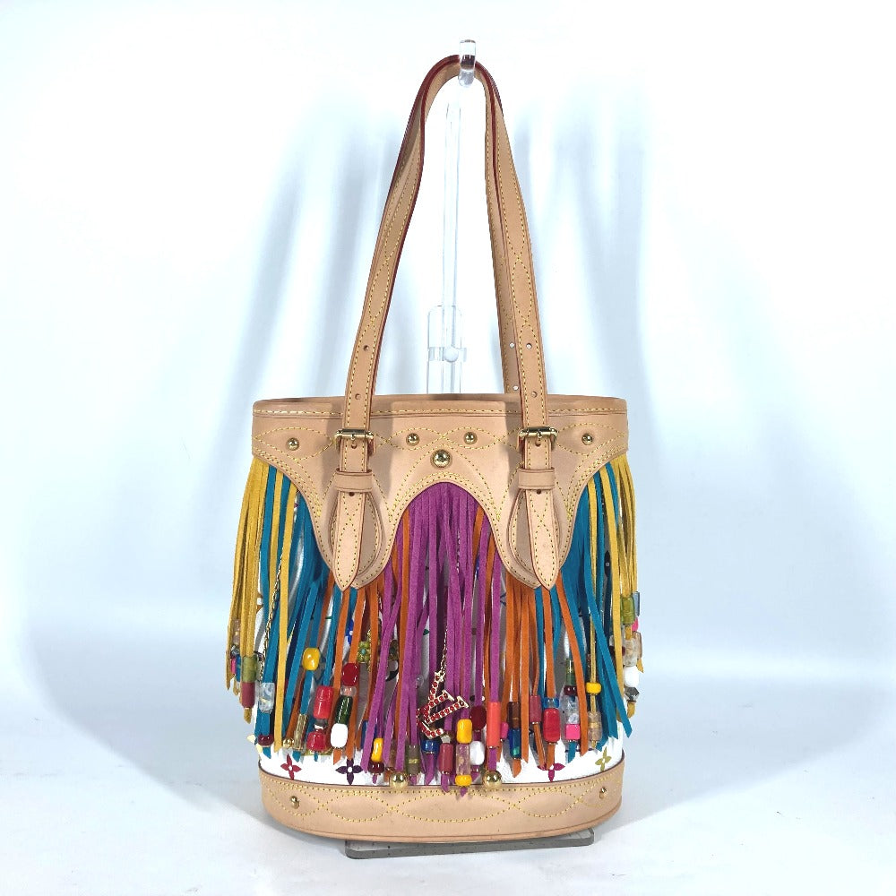 Beige handbag with colorful fringe and beads on a white background