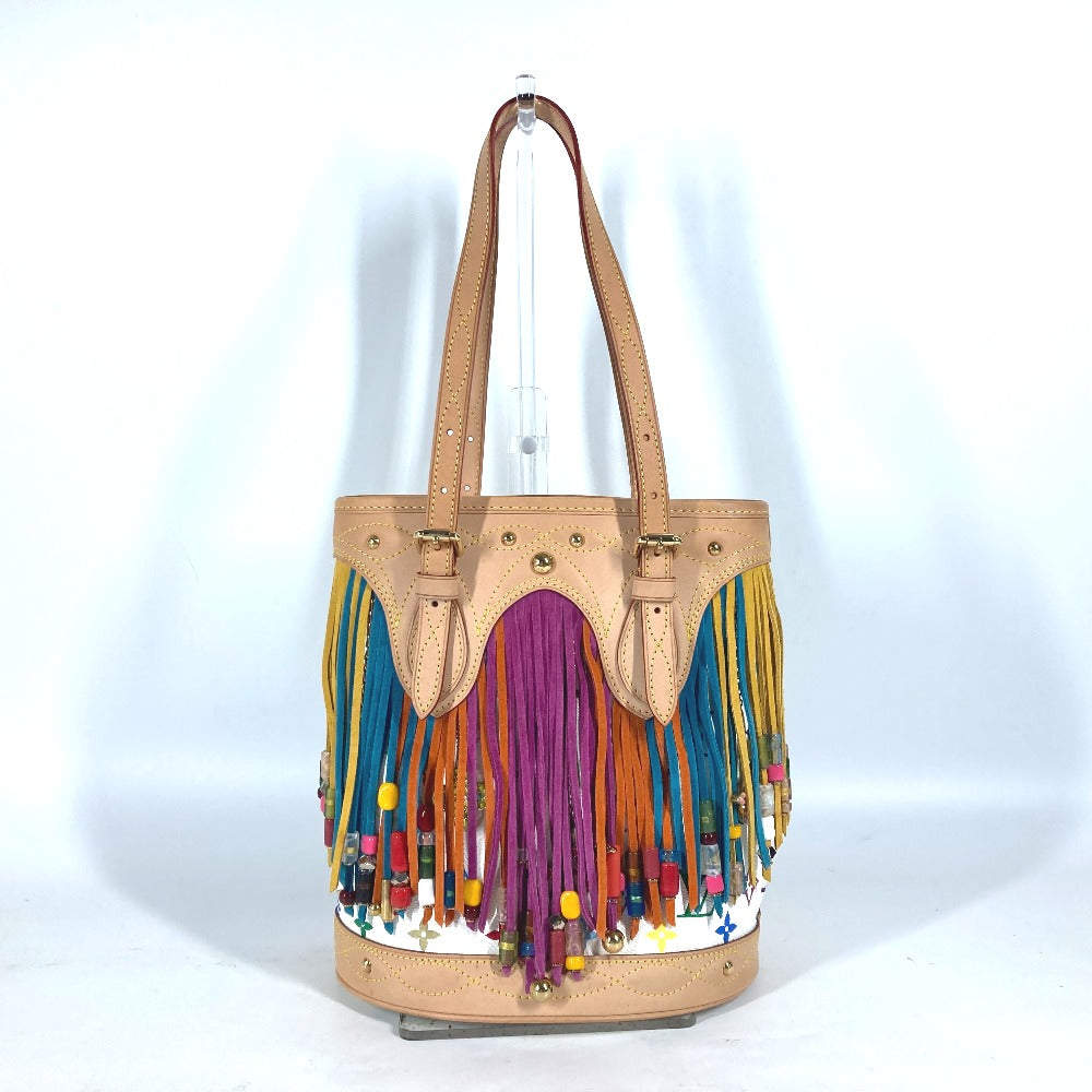 Beige handbag with colorful fringes on a white background