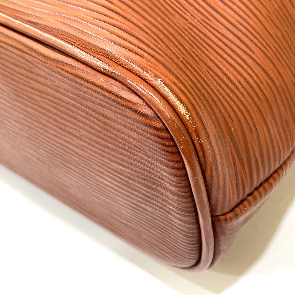 Close-up of a brown textured clutch bag on a white background