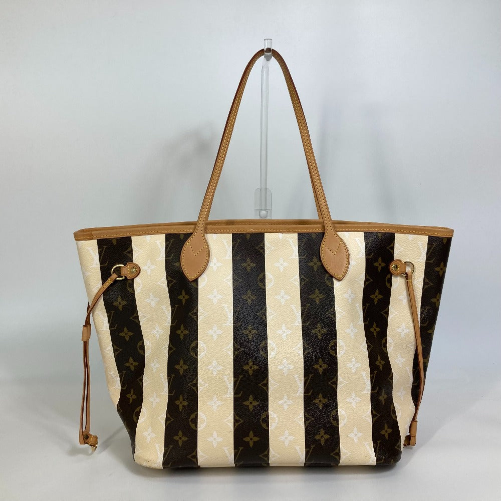 Designer handbag with black and beige striped pattern on a gray background