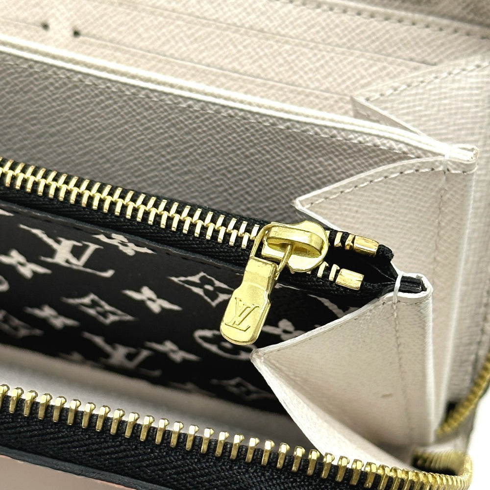 gold zipper Louis Vuitton Monogram Giant Crafty Zippy Wallet Creme Caramel