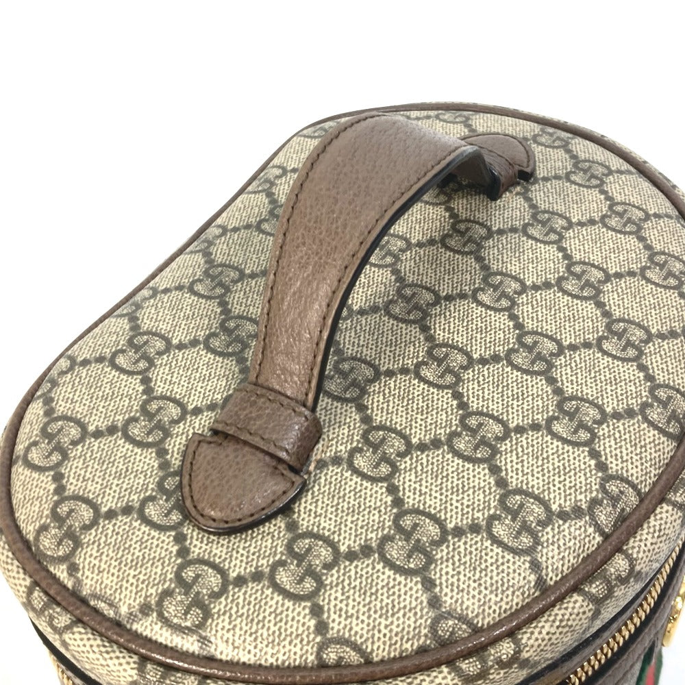 Round travel case with Gucci monogram pattern on a white background