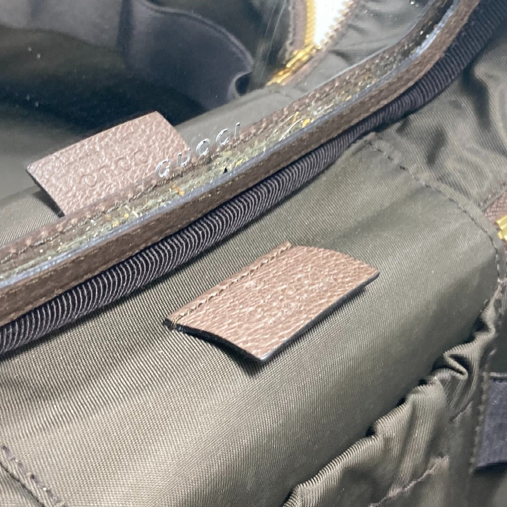 Close-up of a green jacket with reflective material and branding details.